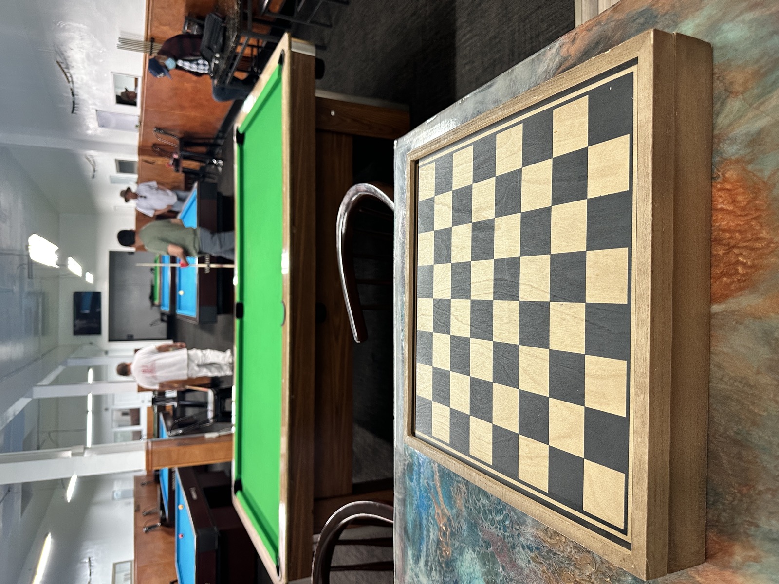 Chess board on display by the tables