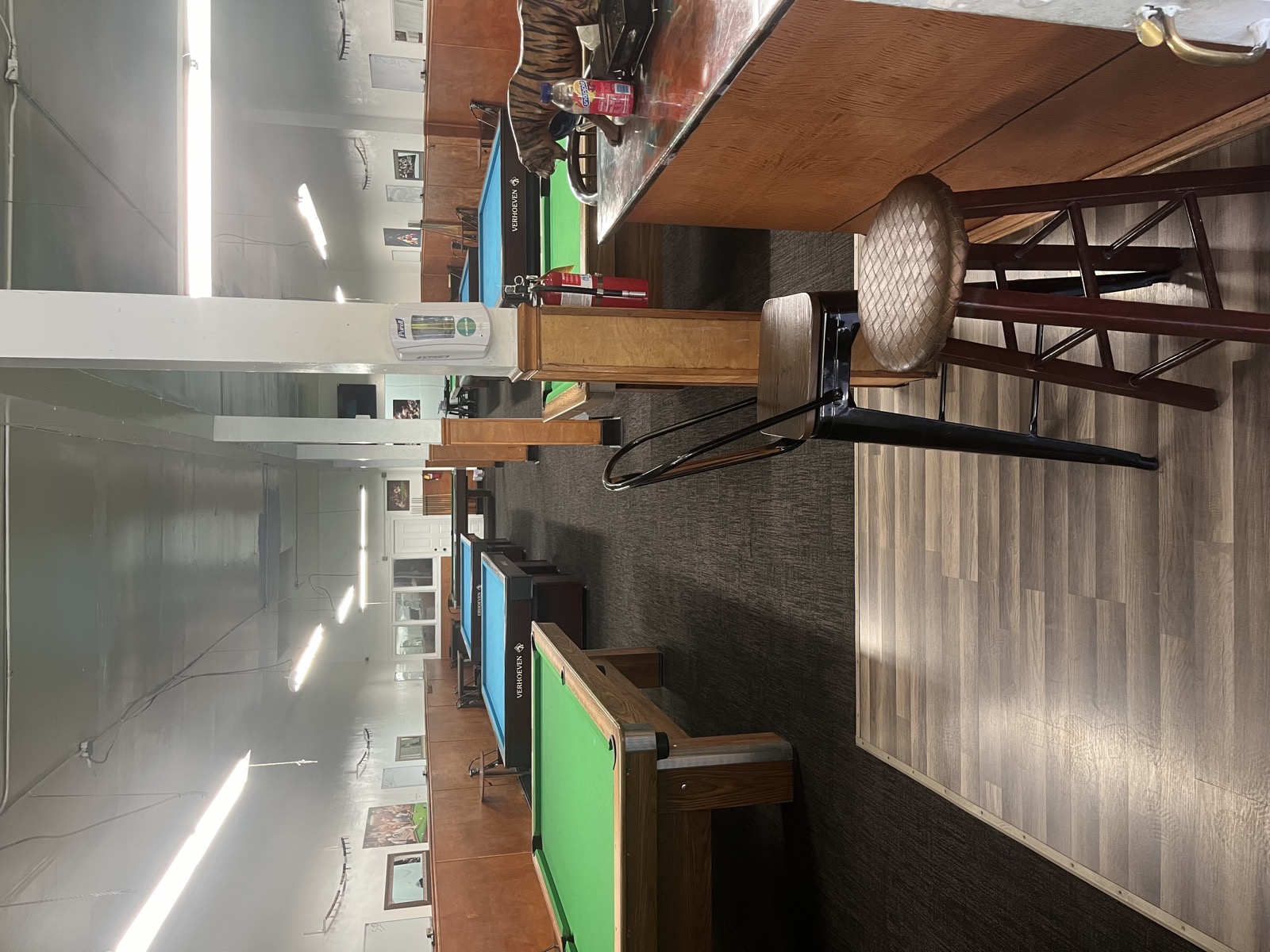 View of the hall with bar stool and tables