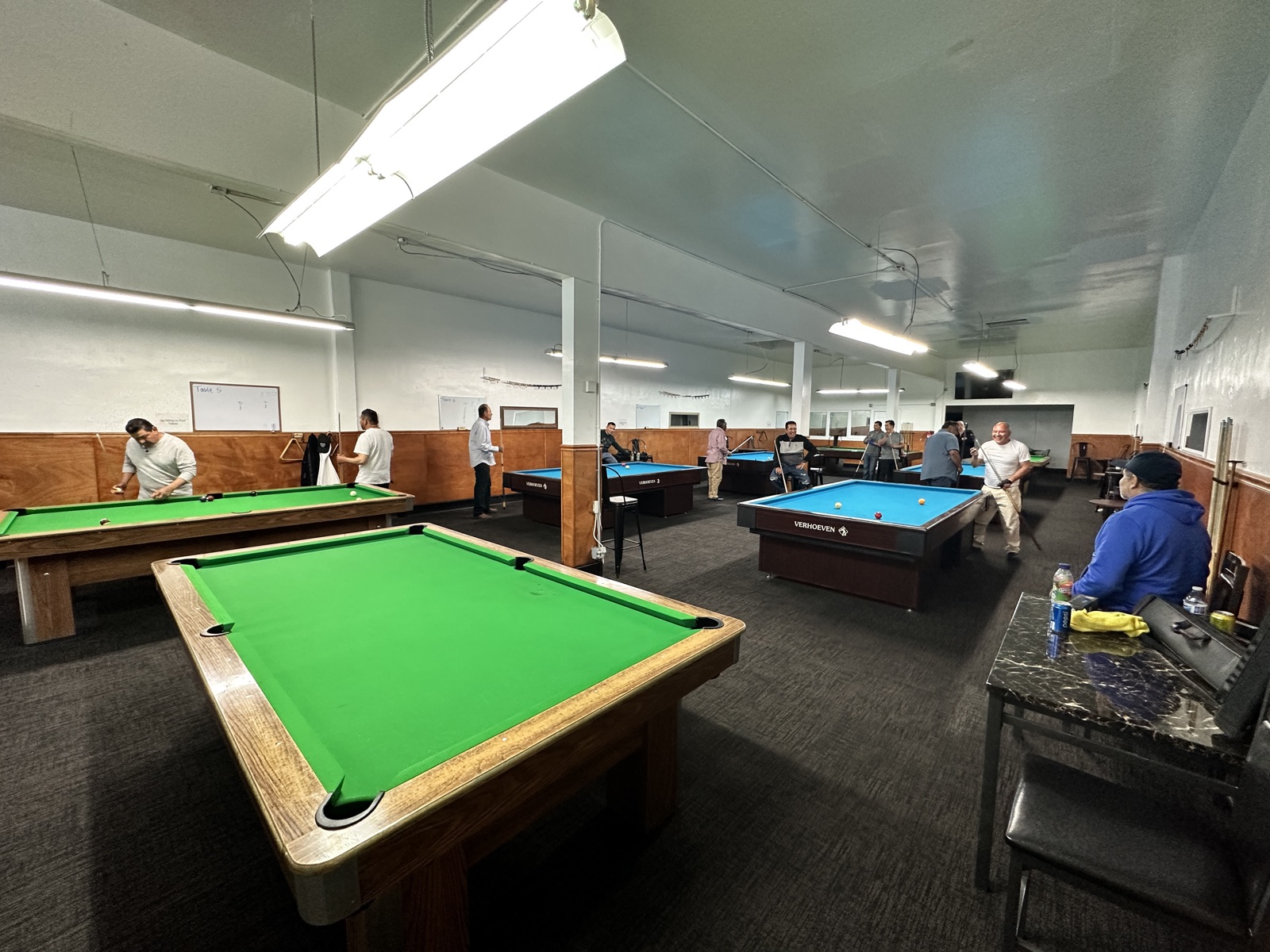 The full hall at 23rd Billiards with players at the tables