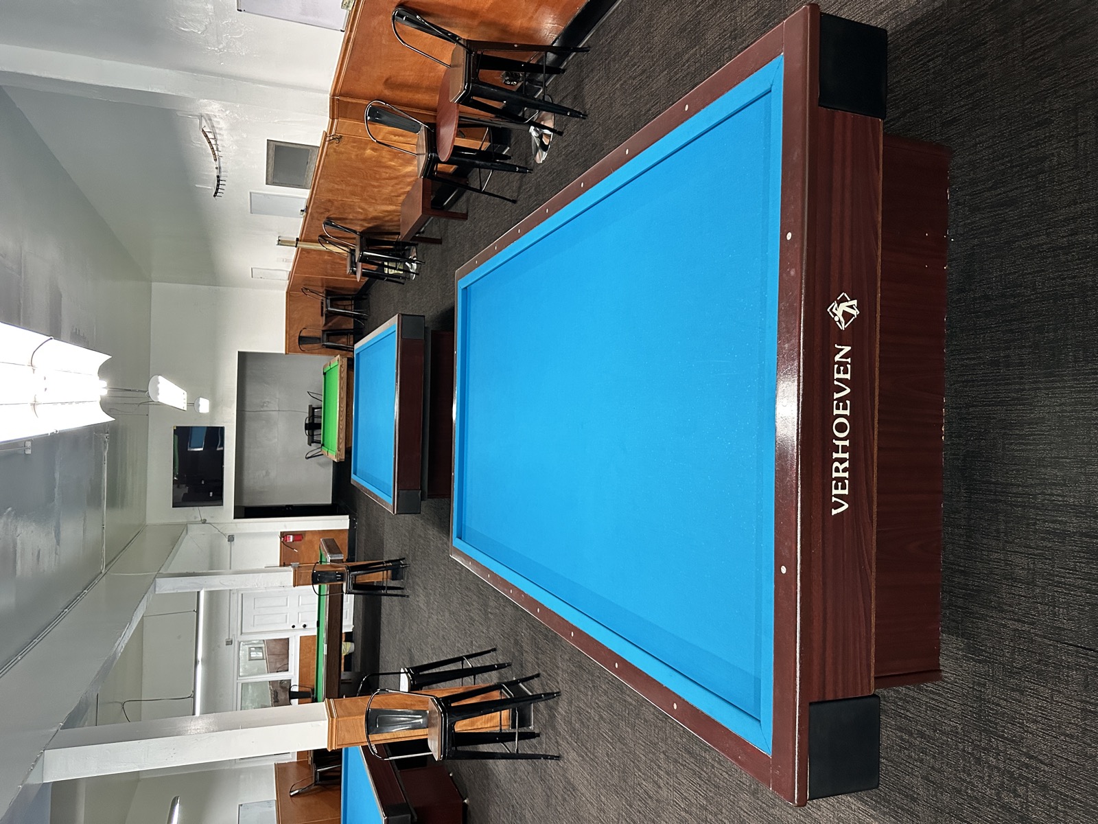 Wide view of a blue Verhoeven table