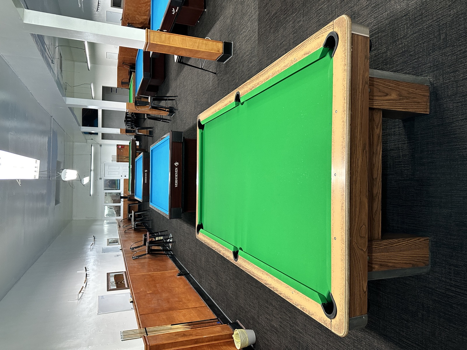 Row of green felt tables